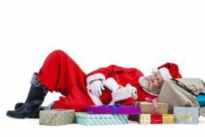 bigstock santa claus sleeping beside ch 156033410