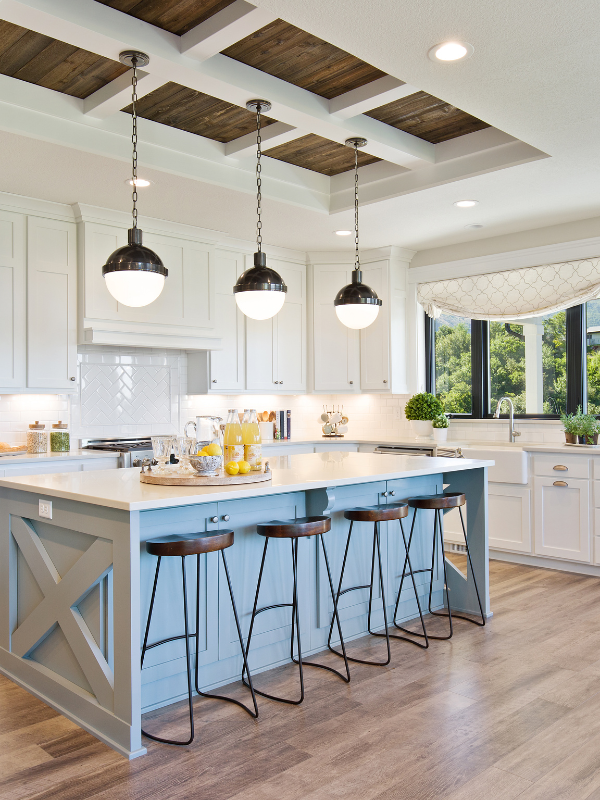 bright open kitchen with accents of beige and bronze.