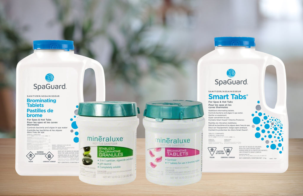 a photo showing different containers of hot tub sanitizers. from left to right pictured; spaguard brominating tablets, mineraluxe stabilized chlorine granules, mineraluxe brominating tablets, and spaguard smart tabs (chlorine).